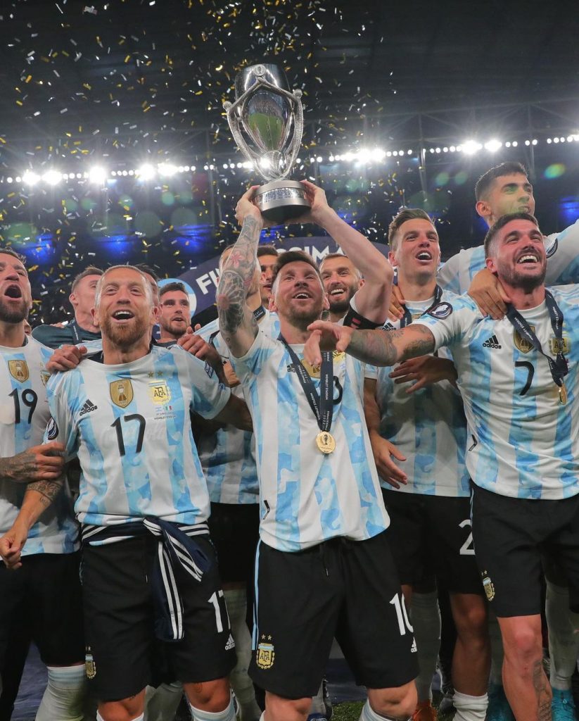 messi lifts trophy cup of champions