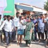 Residents of Siddaramanahundi celebrate outside Siddaramaiah house