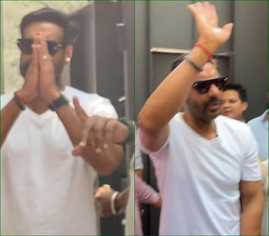 Ajay Devgn greets fans with a namaste outside his residence in Mumbai on 55th b'day