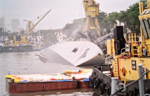 Indian Navy frigate Brahmaputra fully tilts onto one side after onboard fire at Mumbai dockyard (2nd Lead)